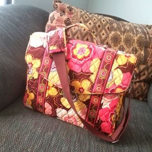 Briefcase with shoulder strap. Lots of storage.